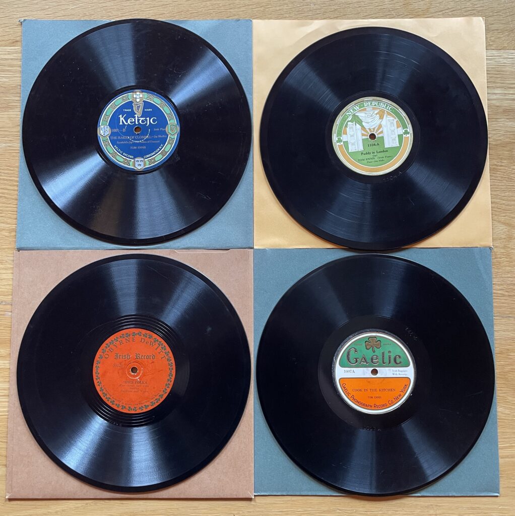 Photo of 4 phonographic records in the NPU Collection recorded by piper Tom Ennis c.1922-24