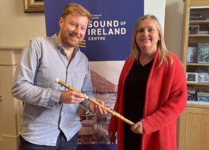 A photo of Piper's lotto winner Carrie Doorley and NPU staff member Éanna Harrington